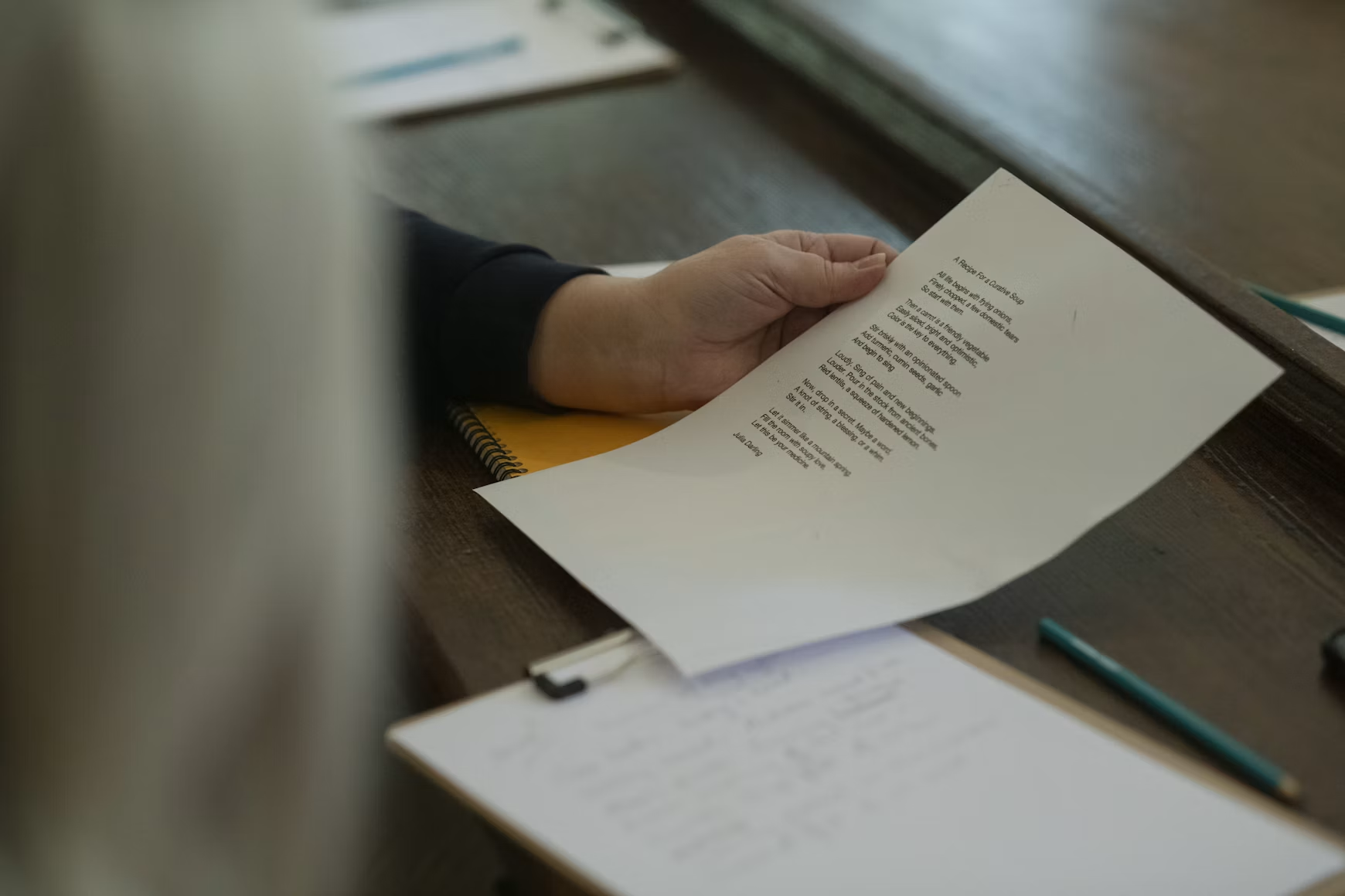 A person reviews a page from their thesis.