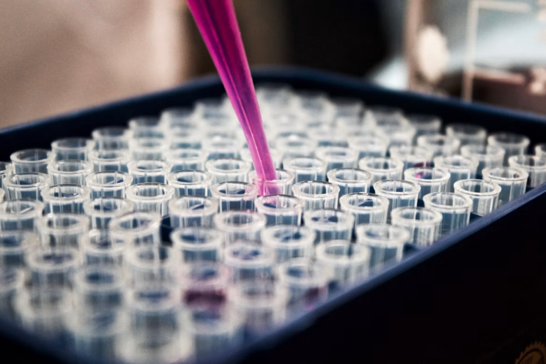 A researcher uses chemicals in a lab.