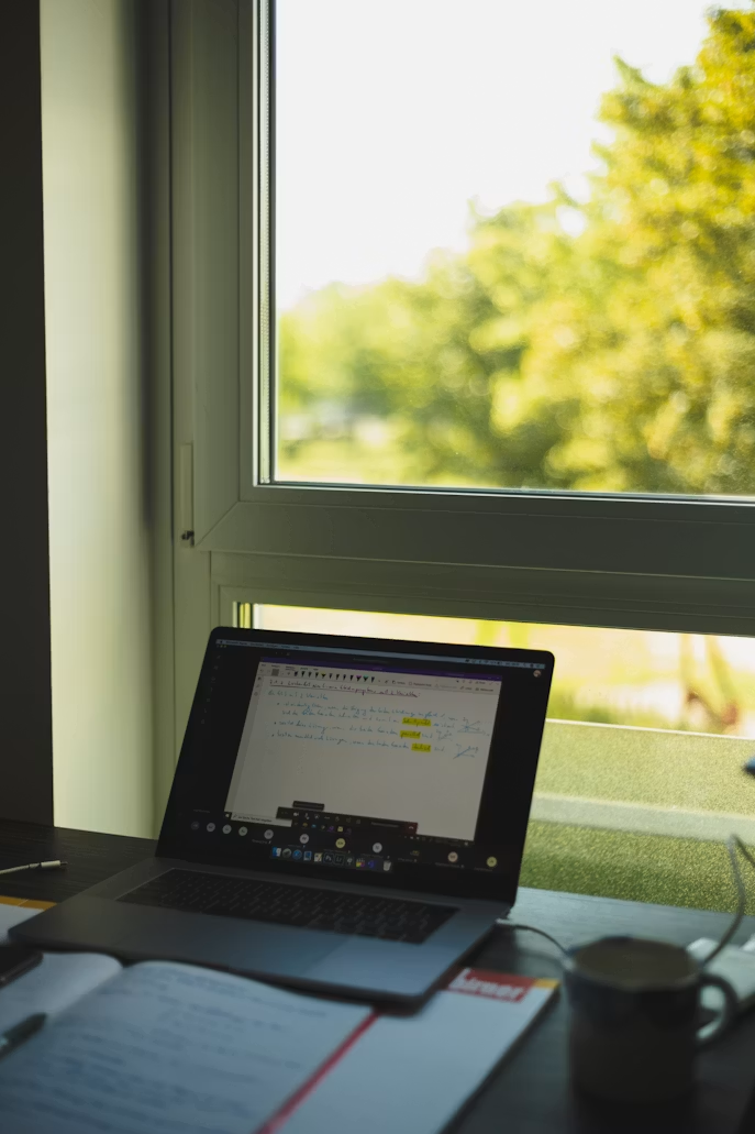 A computer with research writing.