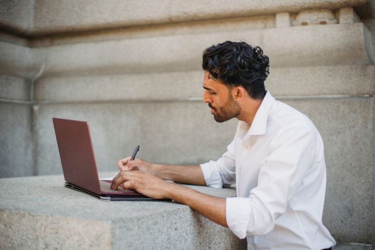 A scholar writes a research paper.